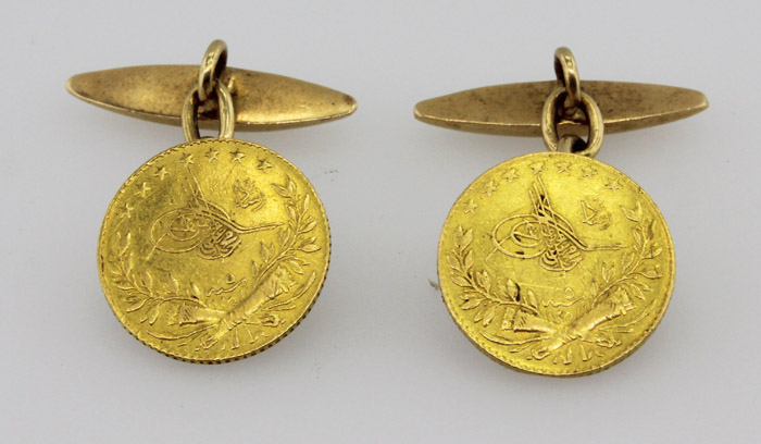 Gold cufflinks crafted from... image