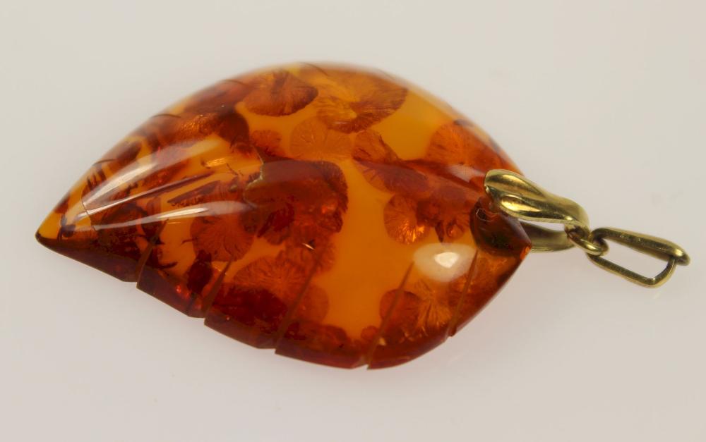 Carved Amber Pendant in the... image