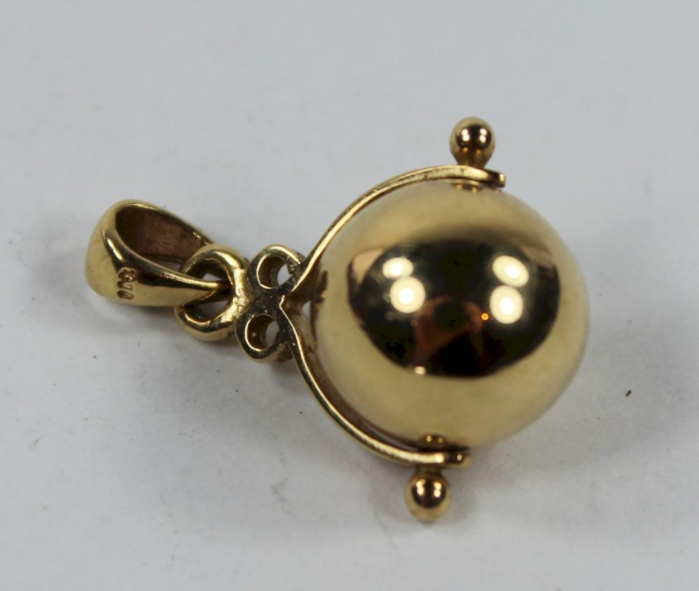 Spinning Gold Ball Charm in... image