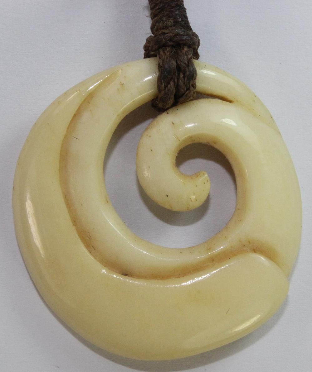 Carved Bone Pendant on a tw... image