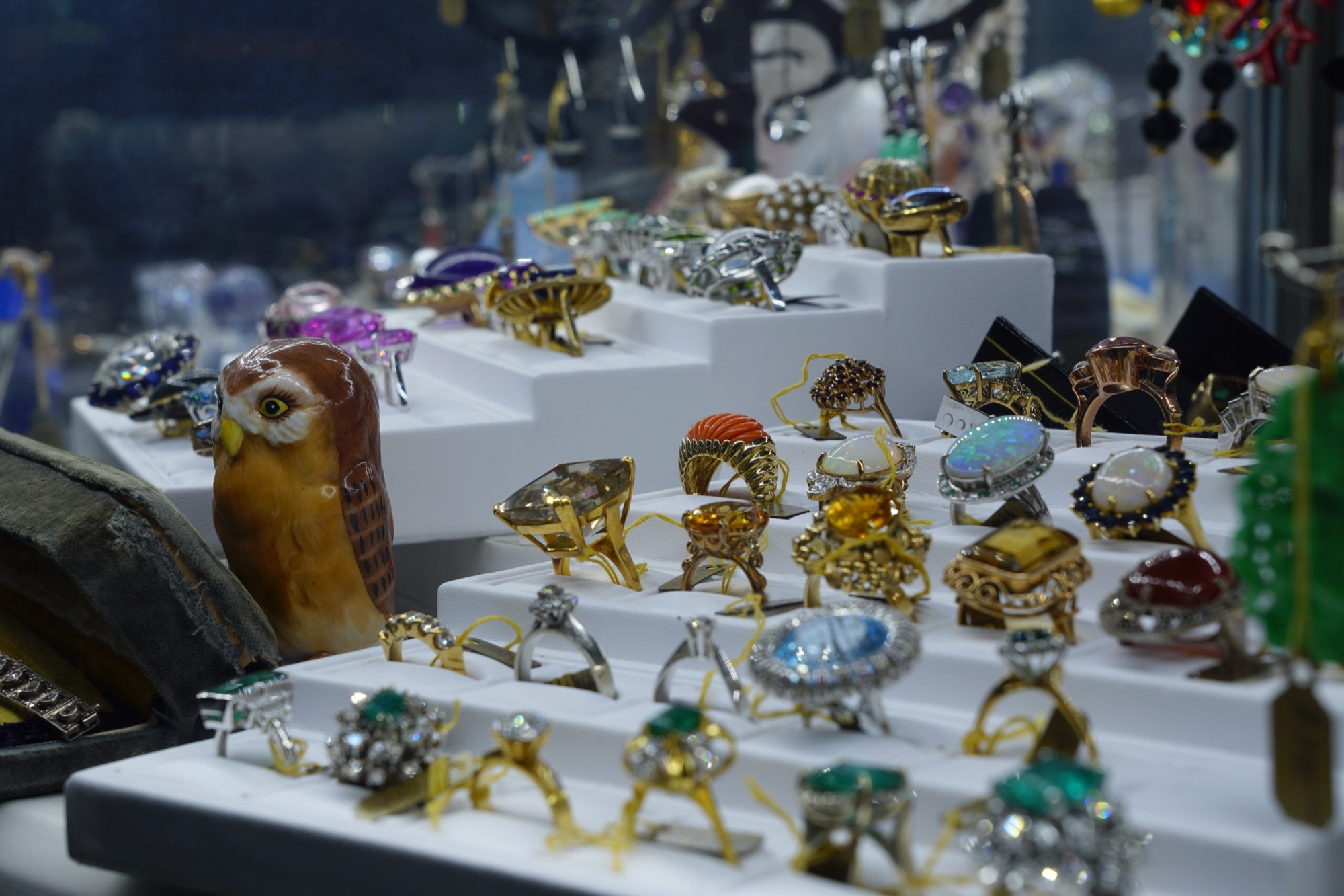 Rings on display in the cabinet at our Oxford Street rooms