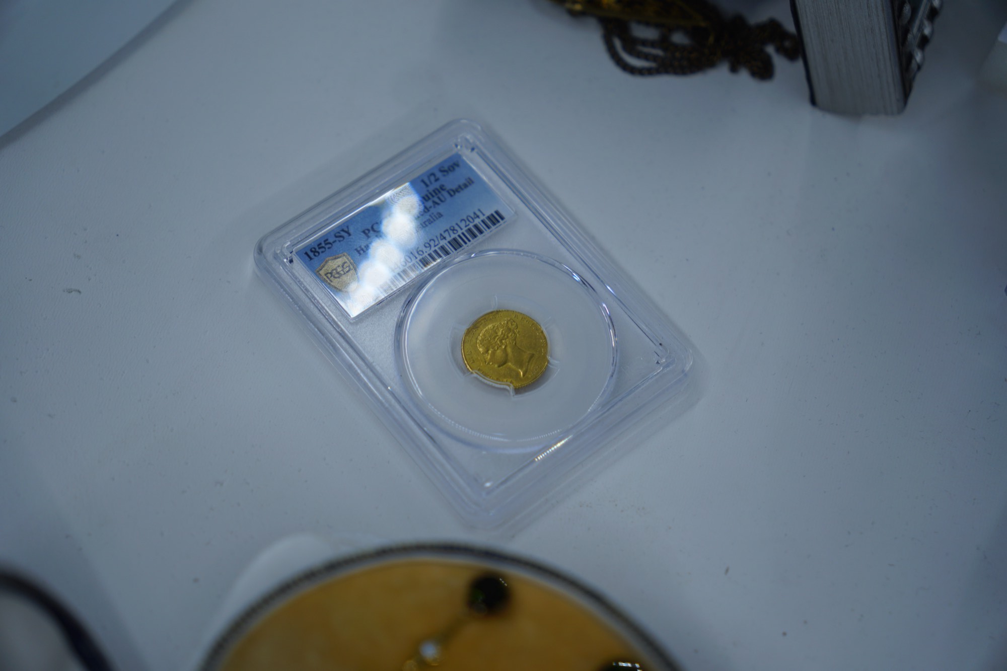 An 1855 Sydney Mint half sovereign in a PCGS holder